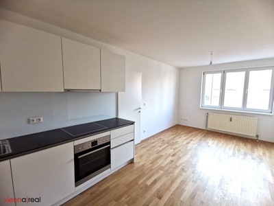 Helle hofseitige 2-Zimmer Neubauwohnung mit Abstellraum, Kellerabteil und Dachterrasse zur Allgemeinnutzung