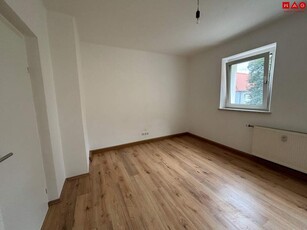 Einladendes Wohnambiente und praktische Raumaufteilung: gemütliche 2-Zimmer-Wohnung mit Grünblick bietet die perfekte Kombination aus naturnahem Wohnen und ausgezeichneter Infrastruktur in Stadtnähe!